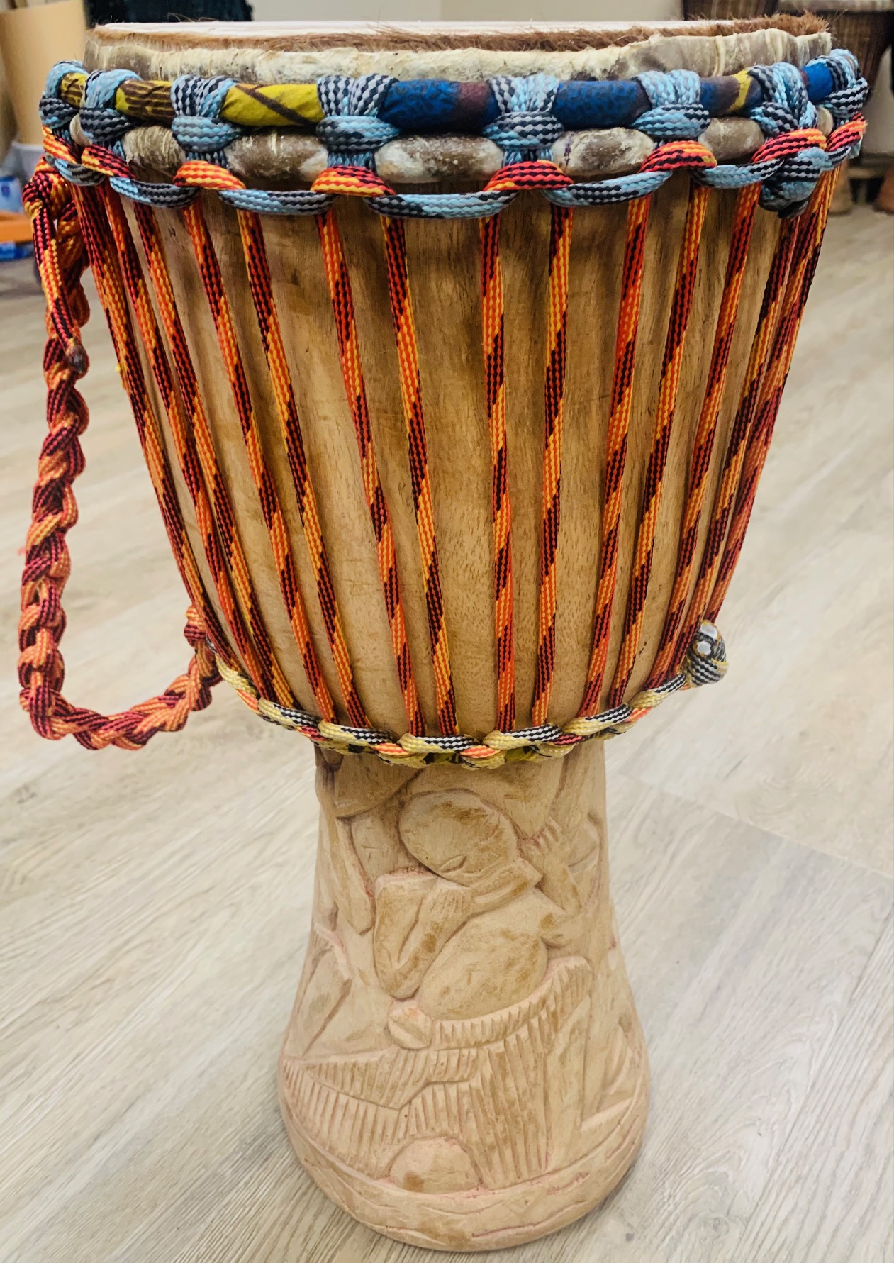 hands playing djembe drums